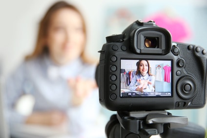 youtuber - Young female blogger on camera screen