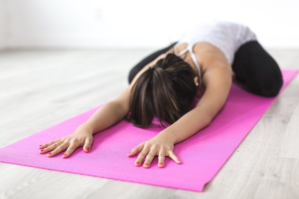 yoga instructor on mat