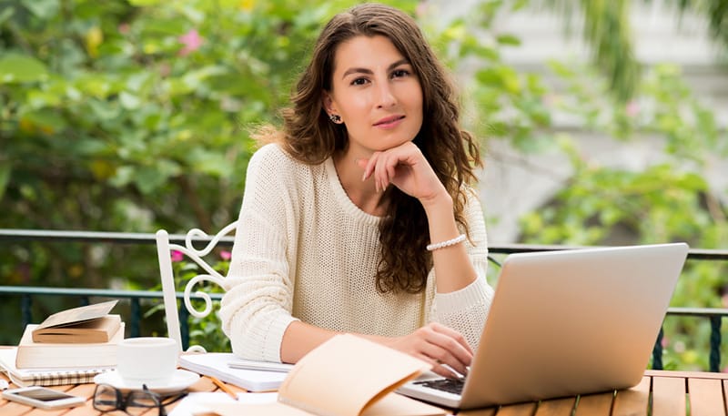 woman at laptop thinking of online businesses to start