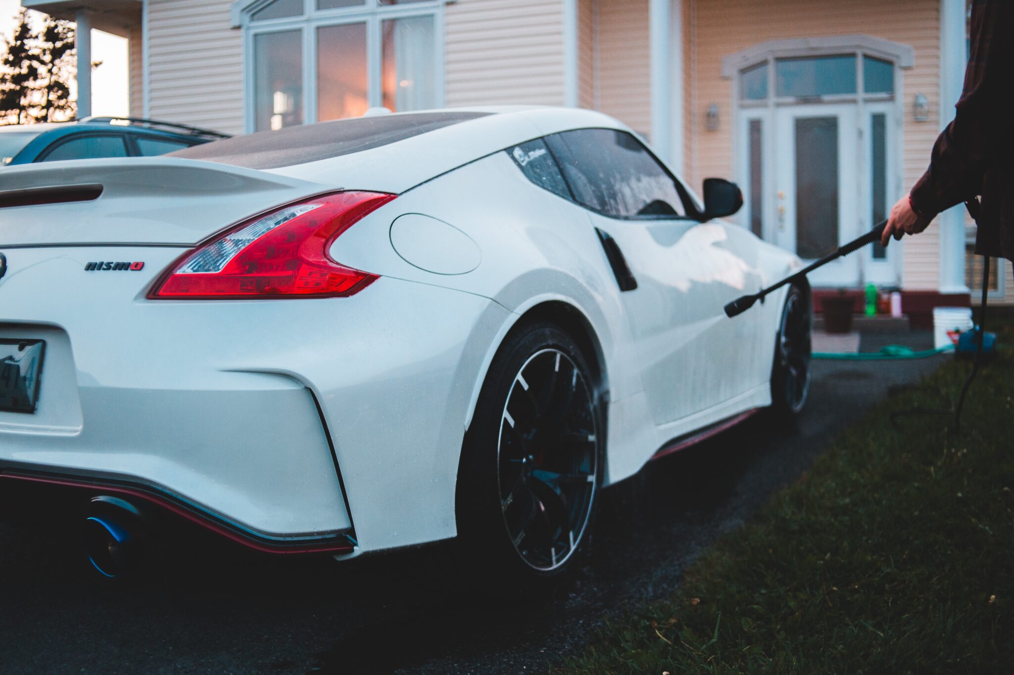 White sports car being washed.