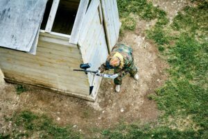 Man on paintball course.