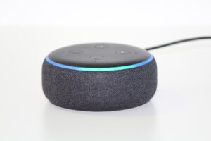 Picture of an Amazon Echo Dot against a white background.