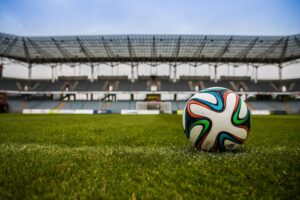 Picture of a soccer ball on a field.