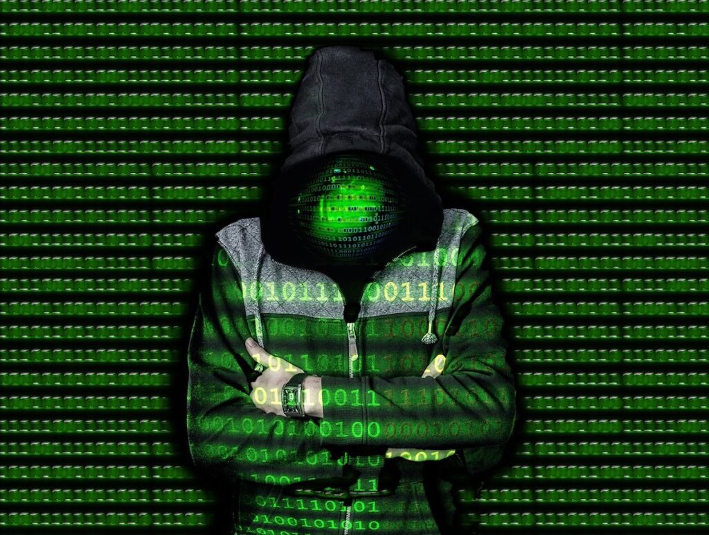 Dark web - Person in black hoodie green zeros and ones