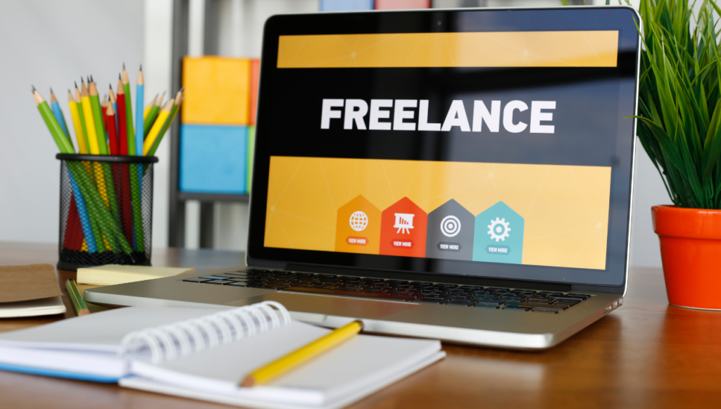 Remote freelance writing jobs for beginners - a laptop with the word freelance on the screen with a bright black and yellow background