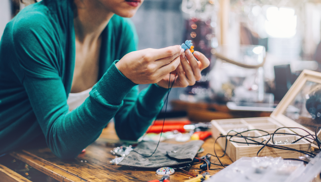 creative business ideas - a woman making some hand crafted jewelry 