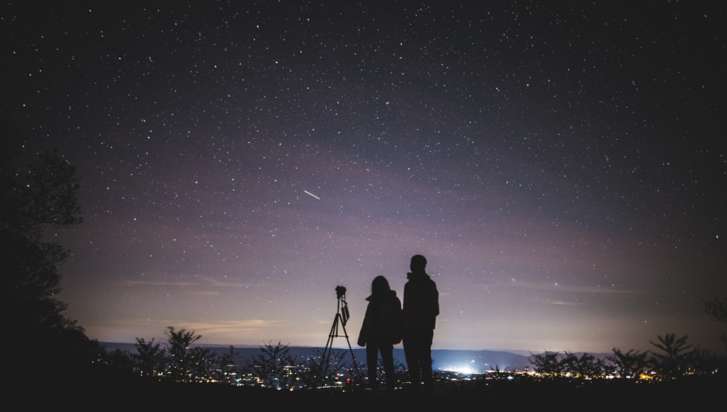 Photography Business Name Idea - a couple taking photos of the night sky 