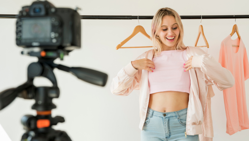 fashion blogging ideas - fashion blogger trying on an outfit in front of a camera