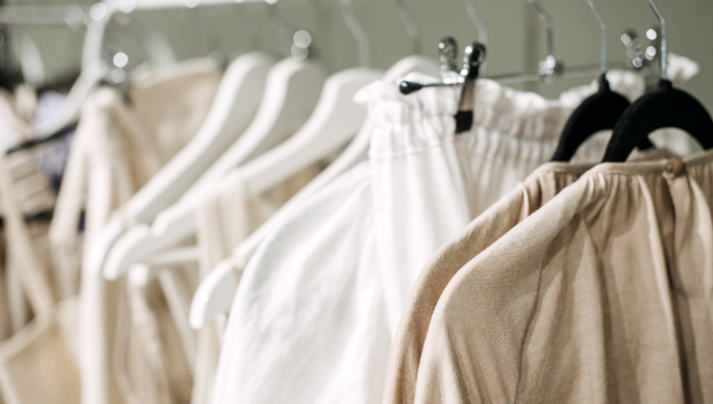 Clothing Business Name Ideas - a rail of linen type clothing in natural colours