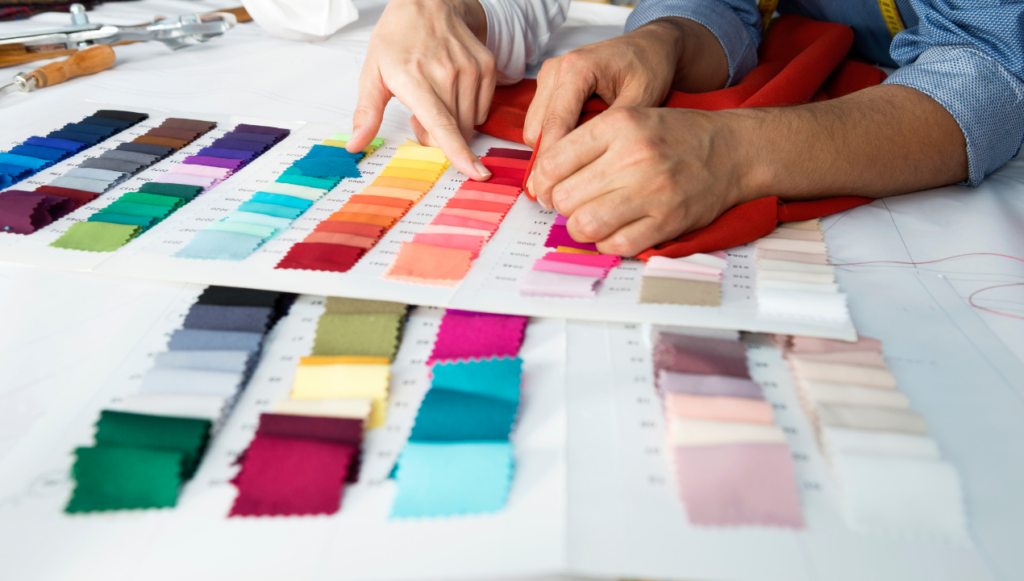 Clothing Business Name Ideas - close up of two people looking at fabric swatches