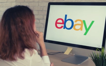 woman looking for ebay selling tools on a computer